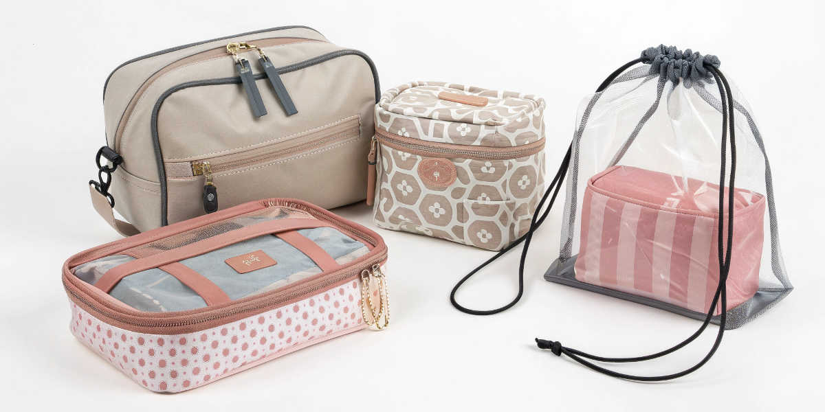 A close-up shot of various customization details on makeup bags: an embossed logo, a custom metal zipper pull, and unique patterned fabric.