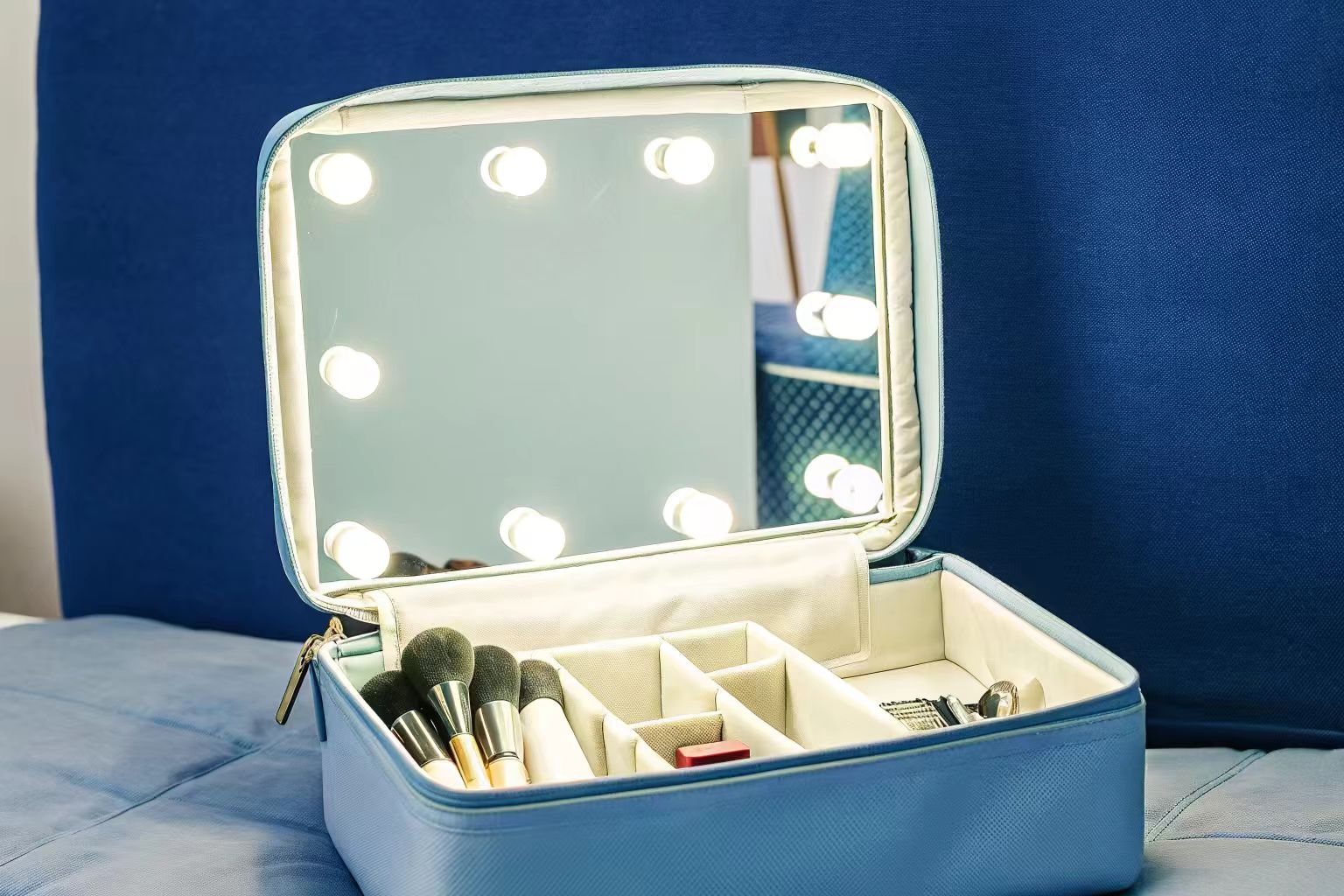 Innovative Materials and Features in Makeup Bags A makeup bag open to show a custom interior with LED lights and special compartments